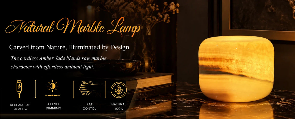 Cordless amber jade natural marble lamp glowing warmly on a dark marble table in an elegant interior