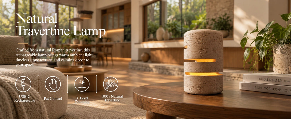 Natural travertine lamp glowing warmly on a wooden side table in a modern living room