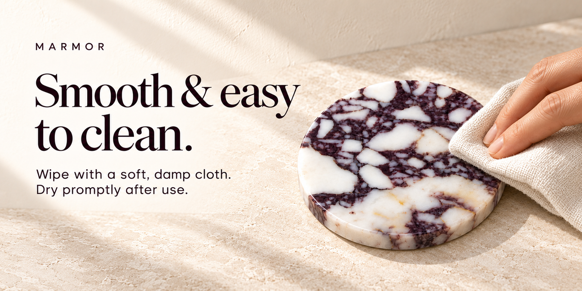 A hand wiping a polished purple marble coaster with a soft cloth.