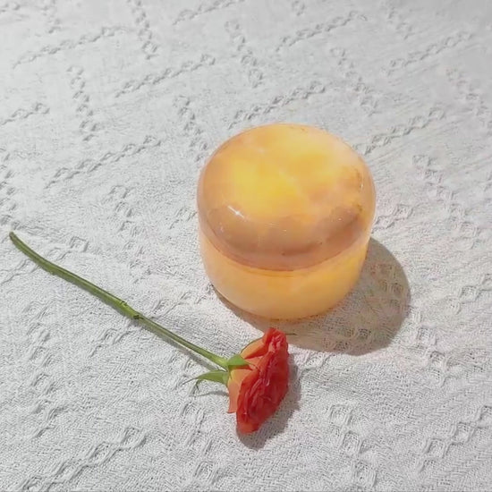 Close-up of amber jade stone on marble touch lamp