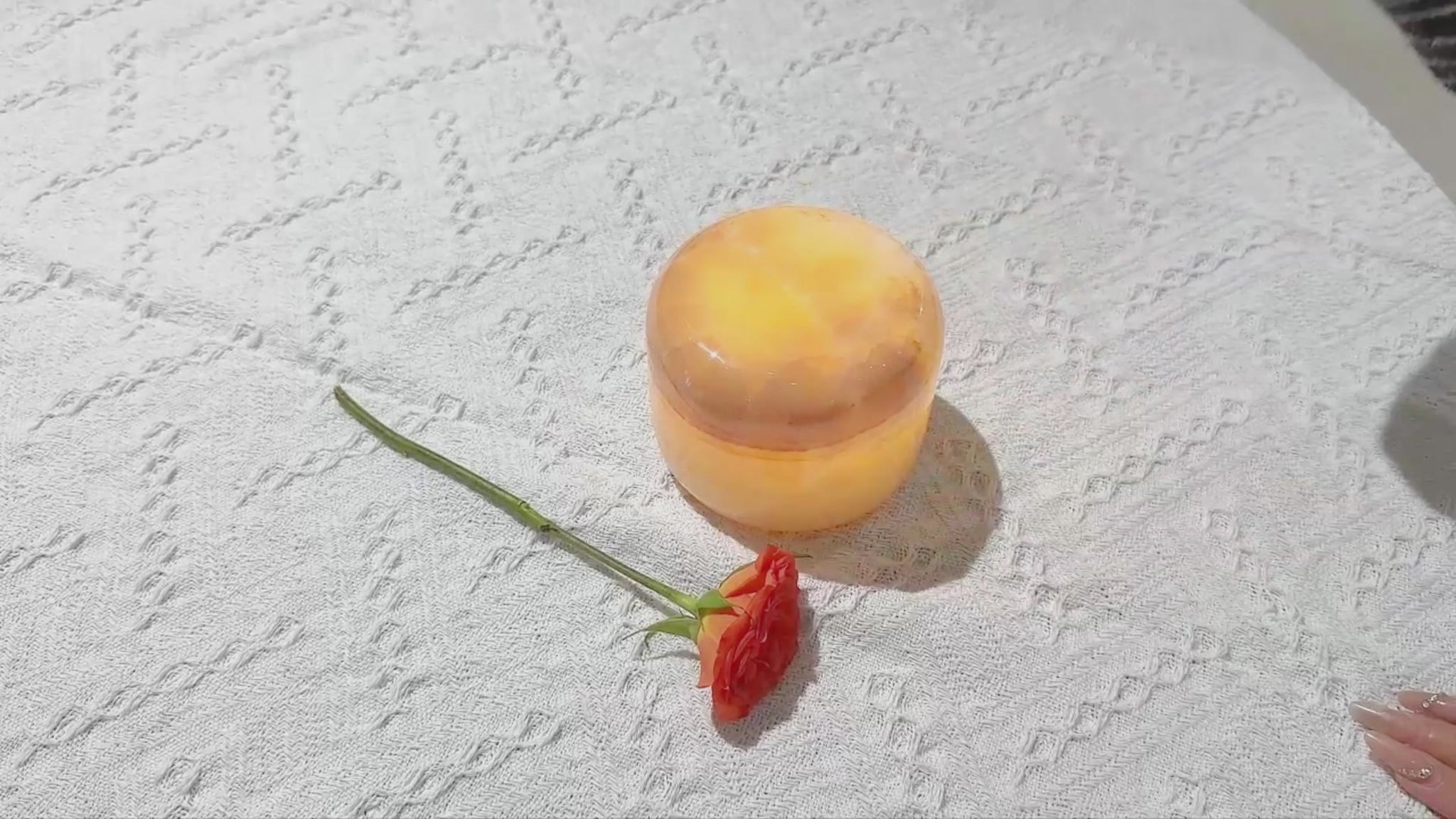Close-up of amber jade stone on marble touch lamp